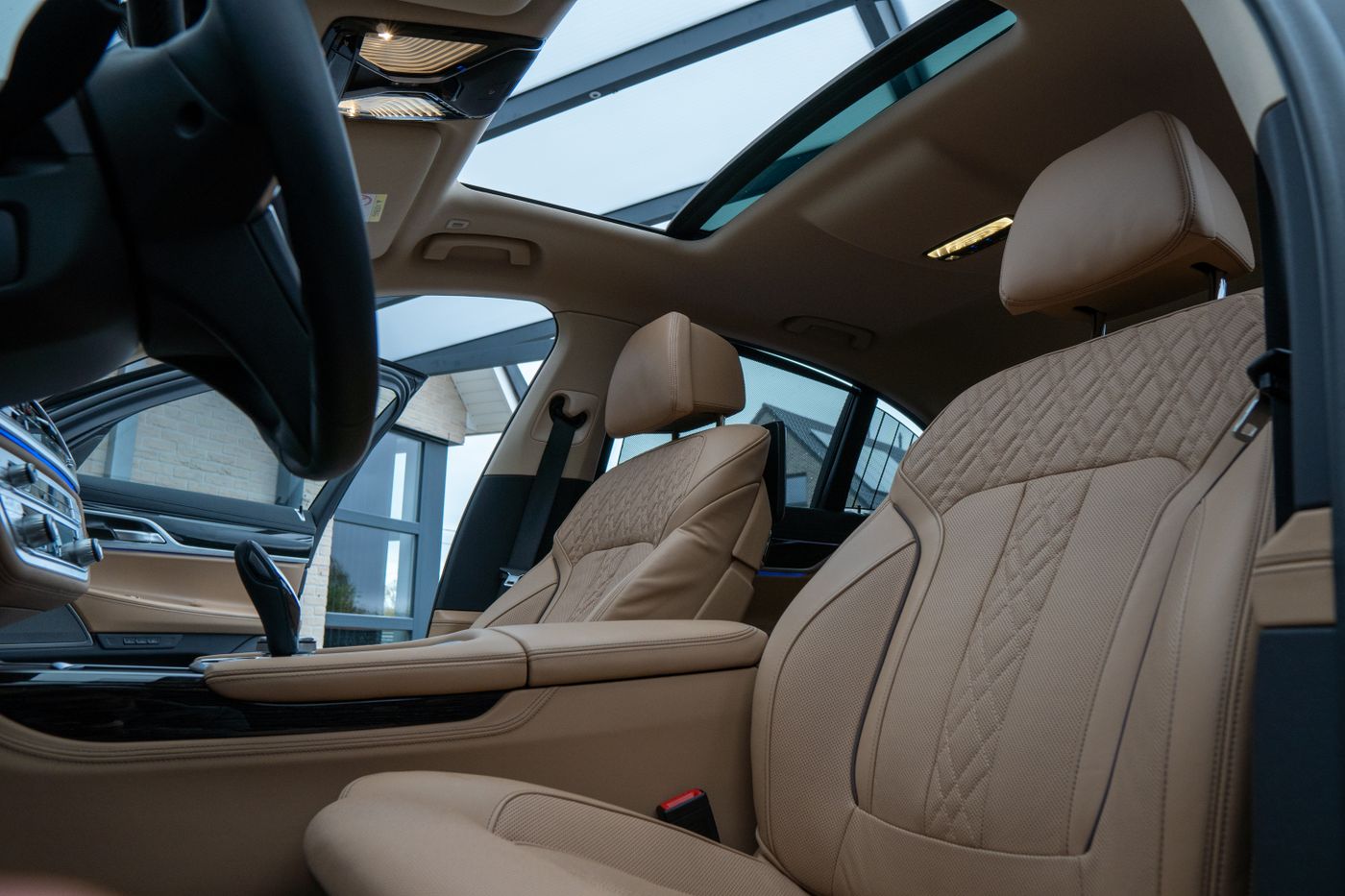 Quilted beige leather seating inside a luxury car